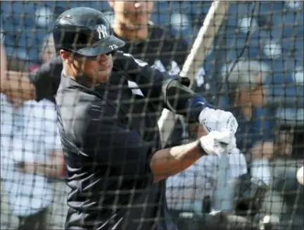  ?? LYNNE SLADKY — THE ASSOCIATED PRESS ?? Seahawks quarterbac­k Russell Wilson hits during batting practice with Yankees before exhibition game against the Phillies, Monday in