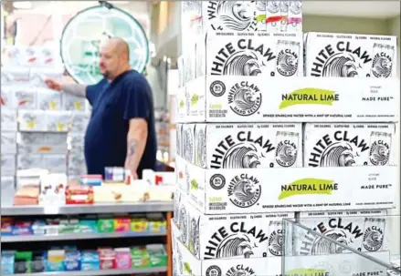  ?? AFP ?? Cartons of White Claw, a flavoured alcoholic fizz in a can on display at the Round The Clock Deli in New York City.