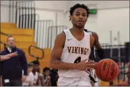  ?? DAN FENNER — FOR MEDIANEWS GROUP ?? Walled Lake Central’s Jeremy Eppes brings the ball up the court against Waterford Kettering in a Lakes Valley Conference game on Friday. Eppes led his Vikings with 12 points in a 58-54win over Kettering.