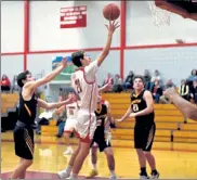  ?? DAVID H.BROW / LOWELL SUN ?? Tyngsboro captain Jason Kelly goes in for a layup against Littleton.