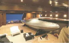  ??  ?? The cavernous, wood-panelled boat deck contains two 30ft Starck designed tenders and a speedboat. Other toys include an amphibious vehicle and jet-skis
