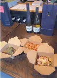  ??  ?? A wine and food order is packed up at VARA Winery & Distillery on Saturday.