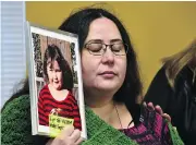 ?? FRANK GUNN / THE CANADIAN PRESS ?? Jennifer Neville-Lake holds a photo of her late daughter Milly following Marco Muzzo’s parole hearing in Gravenhurs­t, Ont., on Wednesday.