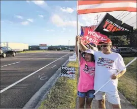  ?? Jaweed Kaleem Los Angeles Times ?? VARA VAIL and her husband, Tom Vail, take part in a rally in Minneola, Fla. The Trump backers support the outgoing president’s false claim of election fraud.