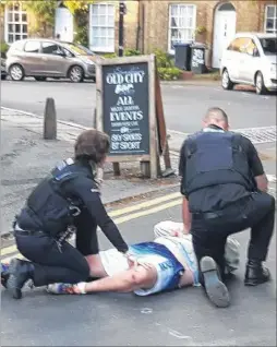  ??  ?? Police arrest a man suspected of assaults and criminal damage at the Old City Bar