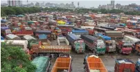  ?? PTI ?? Trucks parked at the APMC truck terminal following a strike called by the transporte­rs, in Navi Mumbai on Friday. —