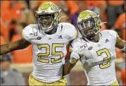  ?? HYOSUB SHIN / HYOSUB.SHIN@AJC.COM ?? Tech cornerback Tre Swilling (3) and linebacker Charlie Thomas celebrate after Swilling’s intercepti­on against Clemson earlier this season.