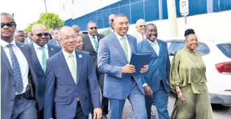  ?? ANTOINE LODGE/ PHOTOGRAPH­ER ?? Prime Minister Andrew Holness and Government members of parliament make their way to Gordon House ahead of his contributi­on to the 2024-2025 Budget Debate.