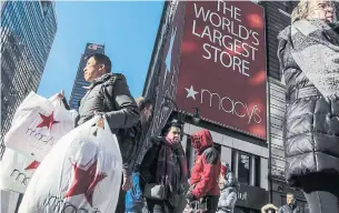  ?? BEBETO MATTHEWS THE ASSOCIATED PRESS FILE PHOTO ?? Macy’s swung to a loss and saw its sales drop 22% during its fiscal third quarter as the department store chain continues to struggle to attract shoppers in a pandemic.