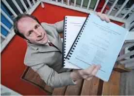  ?? Photograph: MediaNews Group/Boston Herald/Getty Images ?? Rick Doblin displays two volumes of a medical marijuana lawsuit against the DEA, in 2012.