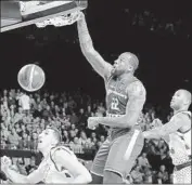  ?? David Pintens AFP/Getty Images ?? CLIFF ALEXANDER dunks against Germany’s Brose Bamberg in Belgium in May.