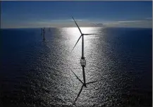  ?? ERIC THAYER / BLOOMBERG ?? States in the Northeast are hoping to model an offshore program after the GE-Alstom Block Island Wind Farm off Rhode Island. Most wind farms now are constructe­d in Europe.