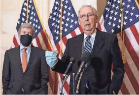  ?? J. SCOTT APPLEWHITE/AP ?? Senate Majority Leader Mitch McConnell, R-Ky., speaks beside Sen. Roy Blunt, R-Mo. Blunt said both sides have said they want a stimulus deal, “but both sides are saying the one they want.”