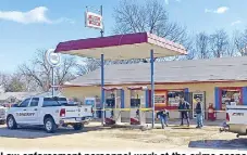  ?? AP ?? Law enforcemen­t personnel work at the crime scene where six people were fatally shot in the town of Arkabutla, Mississipp­i on Friday.