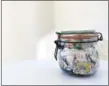  ?? BEA JOHNSON VIA AP ?? This Nov. 18, 2017, photo provided by Bea Johnson shows a jar filled with one year of waste produced from Johnson and her family, shown in Mill Valley, Calif. Johnson and her family have produced a mere pint of trash per year since 2008.