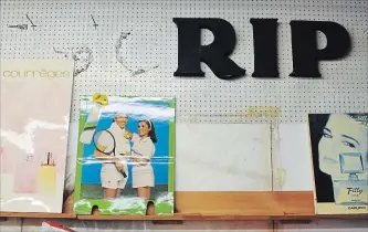  ?? BRENT DAVIS WATERLOO REGION RECORD ?? The remnants of a former Prescripti­ons sign hang high on a wall inside Fritsch Fragrances in Kitchener, surrounded by vintage ads.