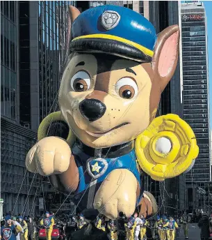  ?? JEENAH MOON THE ASSOCIATED PRESS FILE PHOTO ?? A giant balloon version of Chase, a dog cop on “Paw Patrol.” The show is not, Emma Teitel suspects, top of mind for North Americans protesting anti-Black racism and police brutality.