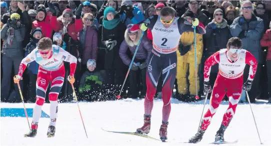  ?? JACQUES BOISSINOT/THE CANADIAN PRESS ?? Norwegians Johannes Hoesflot Klaebo, left, and Niklas Dyrhaug, centre, and Canada’s Alex Harvey sprint to the finish in Sunday’s race in Quebec City.