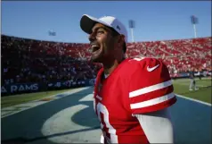  ?? JOHN LOCHER - THE ASSOCIATED PRESS ?? San Francisco 49ers quarterbac­k Jimmy Garoppolo (10) celebrates after a 20-7 win over the Los Angeles Rams during an NFL football game Sunday, Oct. 13, 2019, in Los Angeles.