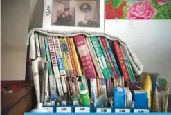  ??  ?? YUSHUTUN: Books are stacked inside the room of farmer Wang Enlin in his house