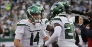  ?? FRANK FRANKLIN II - THE ASSOCIATED PRESS ?? New York Jets quarterbac­k Sam Darnold, left, celebrates with Le’Veon Bell after Bell scored a touchdown during the first half of an NFL football game against the Dallas Cowboys, Sunday, Oct. 13, 2019, in East Rutherford, N.J.