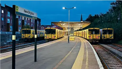  ?? TOM MCATEE ?? Merseyrail’s veteran Class 507 EMUs (built in the late 1970s) are now in the final phase of their working lives with the imminent introducti­on of new Stadler-built Class 777s. This twilight line-up at New Brighton on September 26 shows (from left) Nos. 507030, 507007, 508125, 508130.