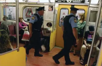  ?? SIMON HAYTER/TORONTO STAR FILE PHOTO ?? Currently, TTC enforcemen­t officers act as uniformed security, ticketing panhandler­s and turnstile jumpers.