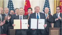  ?? PETE MAROVICH THE NEW YORK TIMES ?? The trade agreement between Chinese Vice-Premier Liu He and U.S. President Donald Trump leaves untouched Beijing’s subsidies for homegrown industries and keeps in place most of Trump’s tariffs on $360 billion worth of Chinese goods.