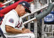  ?? TODD KIRKLAND / GETTY IMAGES ?? Forced to operate in a perpetual “interim” mode, Brian Snitker has managed a rebuilding Braves team as if every win matters.