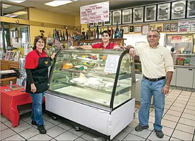  ?? ROD THORNBURG / FOR THE CALIFORNIA­N ?? Kathy and Ted Exarchoula­kos and their son Niko stand inside their Golden Ox Diner on Wilson Road. They have been asked to move by Jan. 15, more than three months before the expiration of their lease, to make room for a new Amazon distributi­on hub at the former Kmart shopping center.