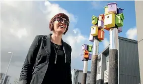  ?? AMY BAKER/STUFF ?? Play street project leader Haylea Muir from Isthmus said the bird houses were ‘‘a bit of whimsy’’.