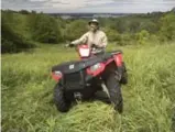  ?? FRED THORNHILL FOR THE TORONTO STAR ?? Sapiano motors on his ATV on his 80-hectare property near Rice Lake, Ont.