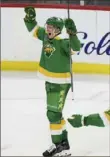  ?? Associated Press ?? Wild left winger Matt Boldy reacts after scoring a goal to win 3-2 in overtime against the Predators on Sunday in St. Paul, Minn.