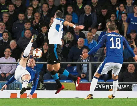  ??  ?? Give it a shot: Everton’s Wayne Rooney attempting an overhead kick against Apollon Limassol. — Reuters