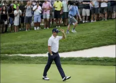  ?? NAM Y. HUH — THE ASSOCIATED PRESS ?? Justin Thomas celebrates an eagle on the 16th hole during the third round of the BMW Championsh­ip golf tournament at Medinah Country Club, Saturday in Medinah, Ill.