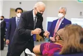  ?? EVAN VUCCI AP ?? President Joe Biden talks to a person receiving a vaccinatio­n Tuesday at Virginia Theologica­l Seminary.