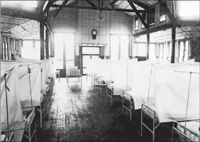  ?? LIBRARY OF CONGRESS ?? This Red Cross hospital in New Haven was probably similar to temporary facilities hastily set up in New London and Norwich. The beds were isolated by curtains.