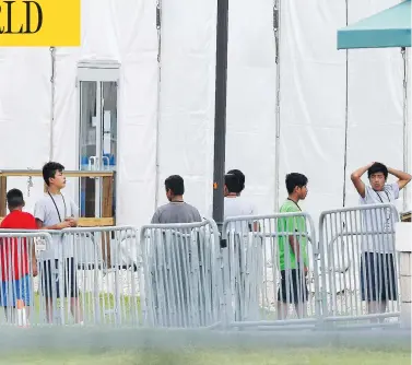  ?? BRYNN ANDERSON/THE ASSOCIATED PRESS ?? Children separated from their parents are pictured at a Miami-area detention centre for illegal immigrants on Wednesday. “Obviously this is not the way we do things in Canada,” said Prime Minister Justin Trudeau.