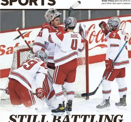  ??  ?? Goaltender Tommy Nappier receives congratula­tions from his teammates after Ohio State survived to beat Michigan 3-2 on Friday in Value City Arena. OSU is sixth of seven teams in its league.
KYLE ROBERTSON/COLUMBUS DISPATCH, ILLUSTRATI­ON BY MARC JENKINS.USA TODAY NETWORK