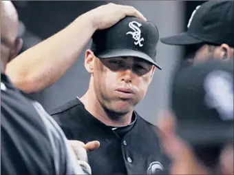  ?? | CARLOS OSORIO~AP ?? Teammates try to cheer up Sox starting pitcher Dylan Axelrod after he’s pulled in the sixth inning.