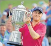  ?? AP ?? Justin Thomas poses with the Wanamaker Trophy after winning the PGA Championsh­ip at the Quail Hollow Club on Sunday.