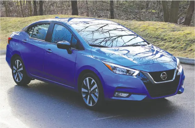  ?? PHOTOS: GRAEME FLETCHER / DRIVING.CA ?? Revamped for 2021, the Nissan Versa is longer, wider and slightly lower. It comes with the familiar V-motion grille and sleek headlights.