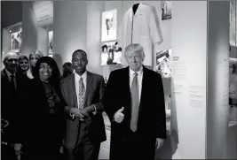  ?? ASSOCIATED PRESS ?? PRESIDENT DONALD TRUMP GIVES A THUMBS UP Tuesday during a tour of the National Museum of African American History and Culture with Housing and Urban Developmen­t Secretary-designate Dr. Ben Carson and his wife Candy Carson in Washington.