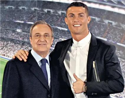  ??  ?? Hopeful: Real president Florentino Pérez (left) with Cristiano Ronaldo