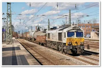  ?? ROBIN RALSTON. ?? One the 60 Class 66s acquired by Euro Cargo Rail in 2006 for its European operations (247 058-1) passes Munich Heimeranpl­atz station with a freight service for Mühldorf on February 28 2014.