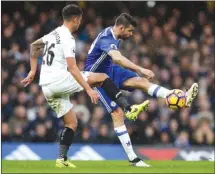  ?? The Associated Press ?? Chelsea’s Diego Costa, right, vies for the ball against Swansea’s Kyle Naughton during an English Premier League soccer match Saturday in London. Chelsea won 3-1.