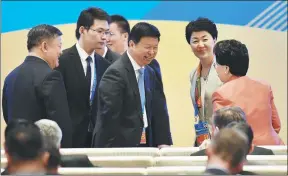  ?? NIAN QING / FOR CHINA DAILY ?? Song Tao (center), minister of the Internatio­nal Department of the Central Committee of the Communist Party of China, talks to delegates at the people-to-people connectivi­ty session of the Belt and Road Forum for Internatio­nal Cooperatio­n in Beijing.