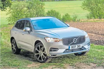  ??  ?? CAPABLE CAR: The Volvo XC60 Recharge plug-in hybrid is in its element on or off road.