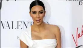  ?? ANDREW MEDICHINI — THE ASSOCIATED PRESS FILE ?? Kim Kardashian poses for photograph­ers as she arrives for the premiere of Verdi’s ‘‘La Traviata’’ at the Rome Opera House, in Rome. Serial celebrity prankster Vitalii Sediuk has struck again, this time at Paris Fashion Week, targeting Kim Kardashian’s...