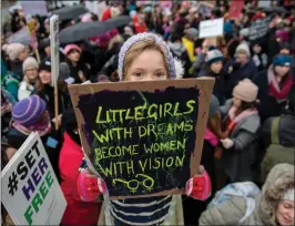  ??  ?? Left: The #MeToo movement and the Time’s Up campaign gave millions of people worldwide a new consciousn­ess regarding sexual assaults on women.
Here, Orla Dean, aged five, holds a placard during a Time’s Up rally in London in 2108.